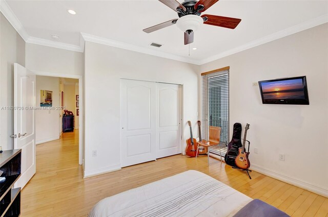 21235 NE 33rd Ave, Aventura, FL 33180 - bedroom with light wood finished floors, ornamental molding, recessed lighting, a closet, and ceiling fan