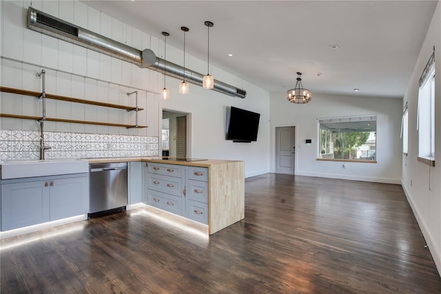 2305 SW 19th Ter, Miami, FL 33145 - kitchen with stainless steel dishwasher, open floor plan, a peninsula, tasteful backsplash, and wood counters