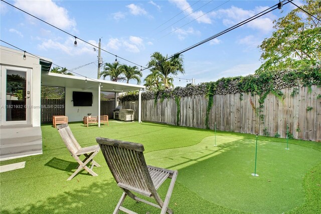2305 SW 19th Ter, Miami, FL 33145 - fenced backyard featuring an area to practice putting