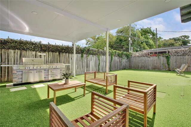 2305 SW 19th Ter, Miami, FL 33145 - fenced backyard with outdoor lounge area and a grill