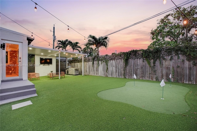 2305 SW 19th Ter, Miami, FL 33145 - fenced backyard featuring an area to practice putting