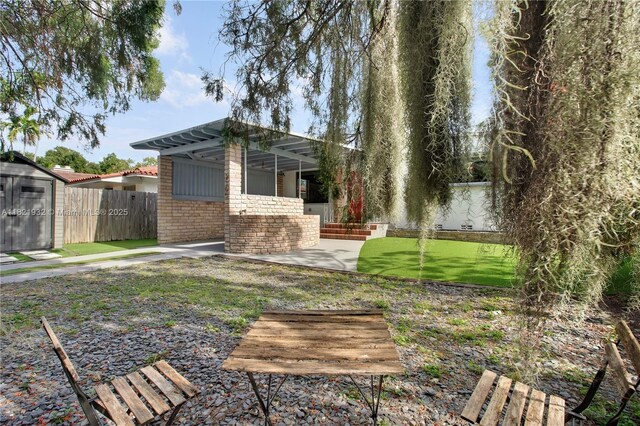 2305 SW 19th Ter, Miami, FL 33145 - fenced backyard with a patio area