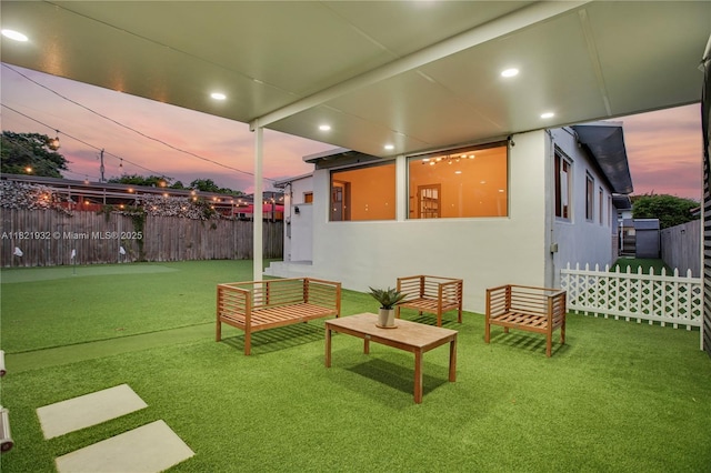 2305 SW 19th Ter, Miami, FL 33145 - yard at dusk with a fenced backyard and a putting area