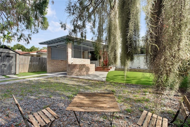 2305 SW 19th Ter, Miami, FL 33145 - fenced backyard featuring a patio area