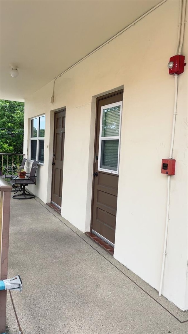 415 NE 2nd St Unit 223, Hallandale Beach, FL 33009 - entrance to property featuring a porch and stucco siding