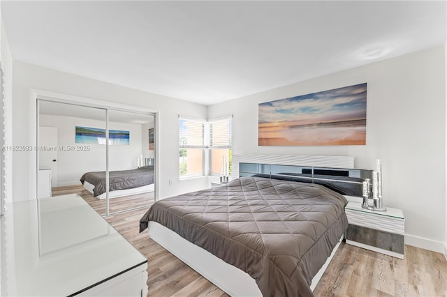2401 SW 10th St Unit 401, Miami, FL 33135 - bedroom featuring light wood finished floors and a closet