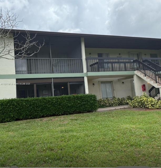 6447 Chasewood Dr Unit C, Jupiter, FL 33458 - view of property with stairs