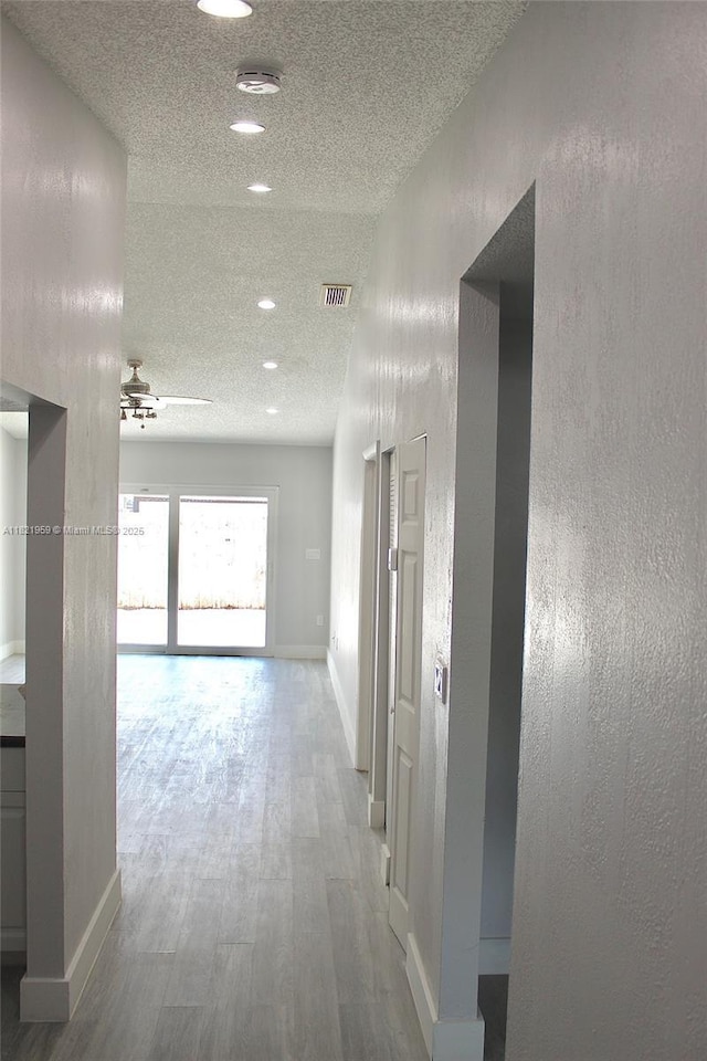 1061 SE 13th Ave Unit 1061, Homestead, FL 33035 - hall with a textured ceiling, wood finished floors, and recessed lighting