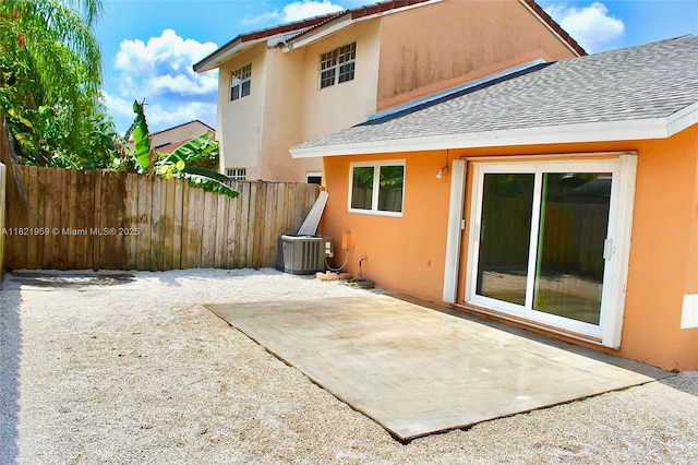 1061 SE 13th Ave Unit 1061, Homestead, FL 33035 - back of property with stucco siding, roof with shingles, and a patio area
