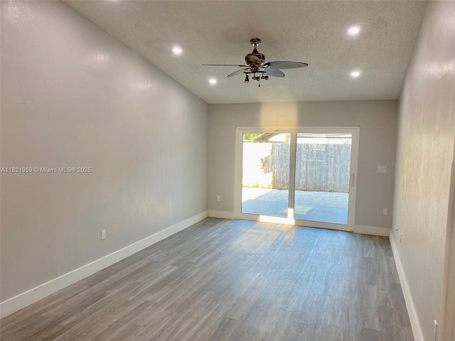 1061 SE 13th Ave Unit 1061, Homestead, FL 33035 - unfurnished room with ceiling fan, wood finished floors, recessed lighting, and a textured ceiling