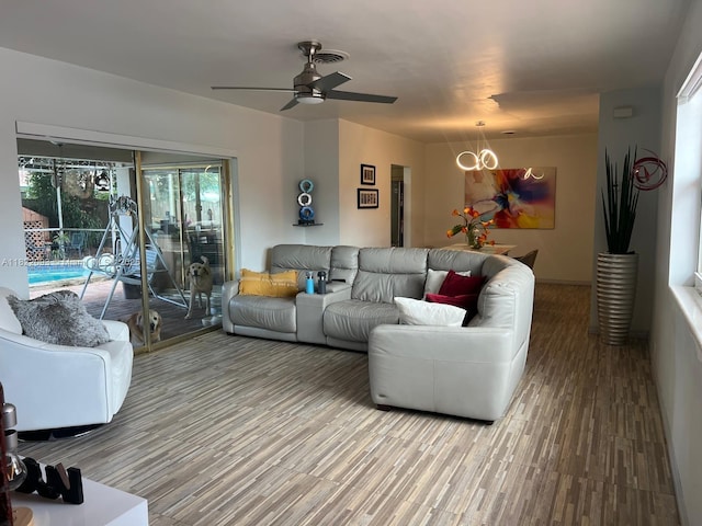 7110 SW 11th St, Pembroke Pines, FL 33023 - living room featuring a chandelier, ceiling fan, and wood finished floors