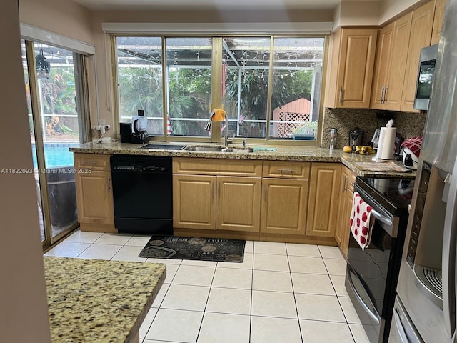 7110 SW 11th St, Pembroke Pines, FL 33023 - kitchen with stainless steel appliances, light tile patterned floors, tasteful backsplash, and light stone counters
