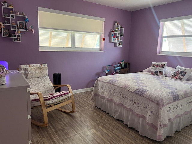 7110 SW 11th St, Pembroke Pines, FL 33023 - bedroom with multiple windows and wood finished floors
