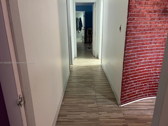 7110 SW 11th St, Pembroke Pines, FL 33023 - corridor featuring baseboards and wood finished floors