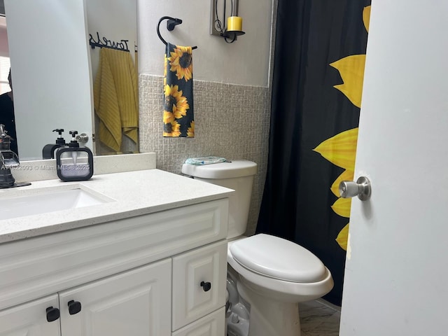 7110 SW 11th St, Pembroke Pines, FL 33023 - bathroom with vanity, tile walls, a wainscoted wall, and a shower with shower curtain