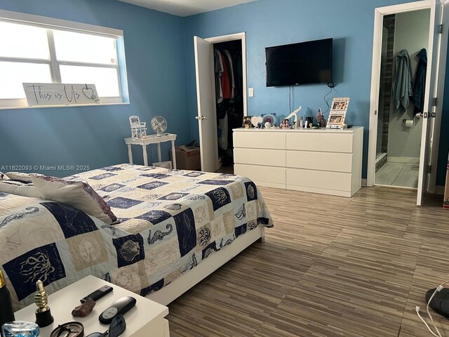7110 SW 11th St, Pembroke Pines, FL 33023 - bedroom featuring a walk in closet and connected bathroom
