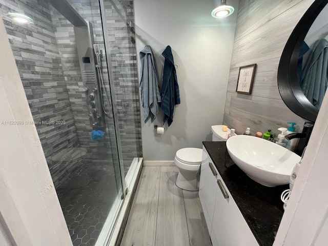 7110 SW 11th St, Pembroke Pines, FL 33023 - bathroom with vanity, a stall shower, and wood finished floors