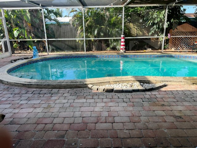 7110 SW 11th St, Pembroke Pines, FL 33023 - view of pool with a lanai and a patio area