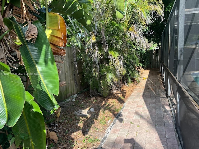 7110 SW 11th St, Pembroke Pines, FL 33023 - fenced backyard featuring glass enclosure
