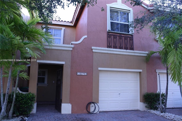 15270 SW 30th Ter, Miami, FL 33185 - view of front of home with an attached garage and stucco siding