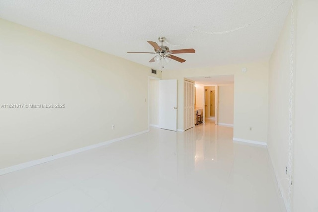 11 Island Ave Unit 1410, Miami Beach, FL 33139 - empty room featuring ceiling fan and a textured ceiling