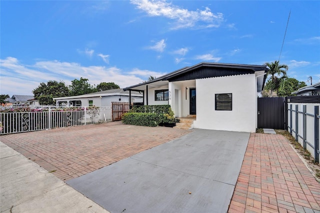 539 E 30th St, Hialeah, FL 33013 - view of front of house featuring stucco siding and a porch