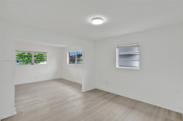 539 E 30th St, Hialeah, FL 33013 - spare room with light wood-style flooring and baseboards