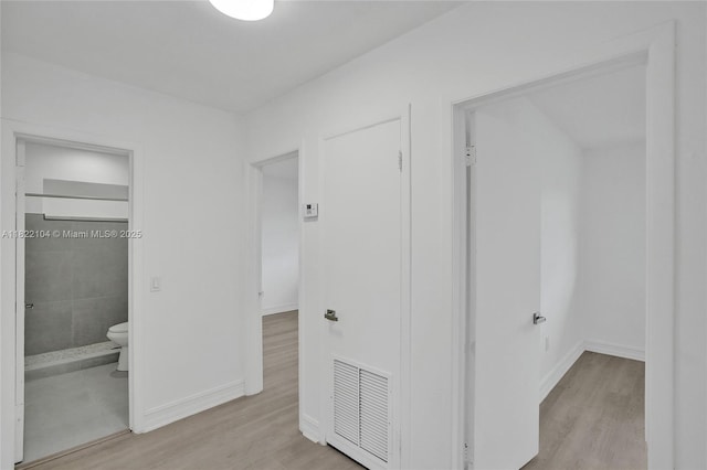539 E 30th St, Hialeah, FL 33013 - unfurnished bedroom with wood finished floors and connected bathroom
