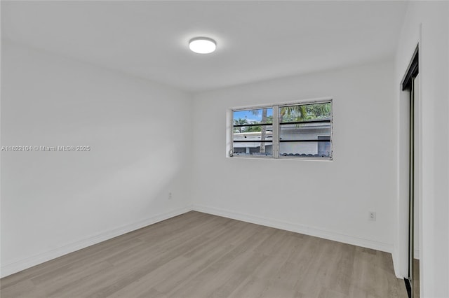 539 E 30th St, Hialeah, FL 33013 - empty room featuring light wood-style floors and baseboards