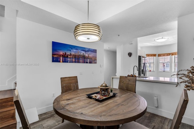 8940 NE 8th Ave Unit 1203, Miami, FL 33138 - dining space featuring wood finished floors