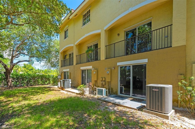 8940 NE 8th Ave Unit 1203, Miami, FL 33138 - rear view of house with stucco siding and a yard