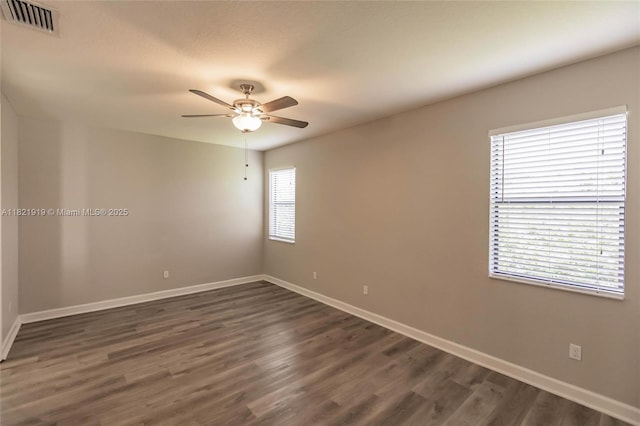 3809 Aspen Leaf Dr, Boynton Beach, FL 33436 - spare room featuring a ceiling fan and dark wood-style flooring