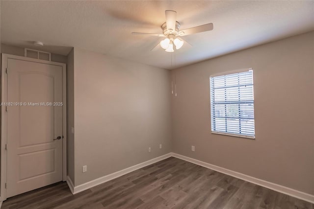 3809 Aspen Leaf Dr, Boynton Beach, FL 33436 - unfurnished bedroom featuring dark wood finished floors and ceiling fan