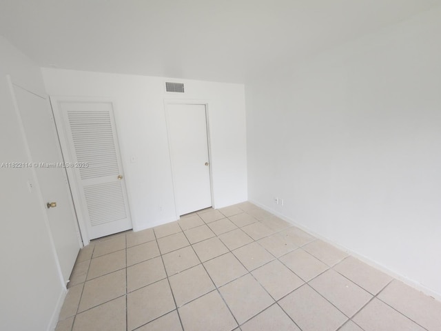 4150 NW 90th Ave Unit 203, Coral Springs, FL 33065 - empty room with light tile patterned floors