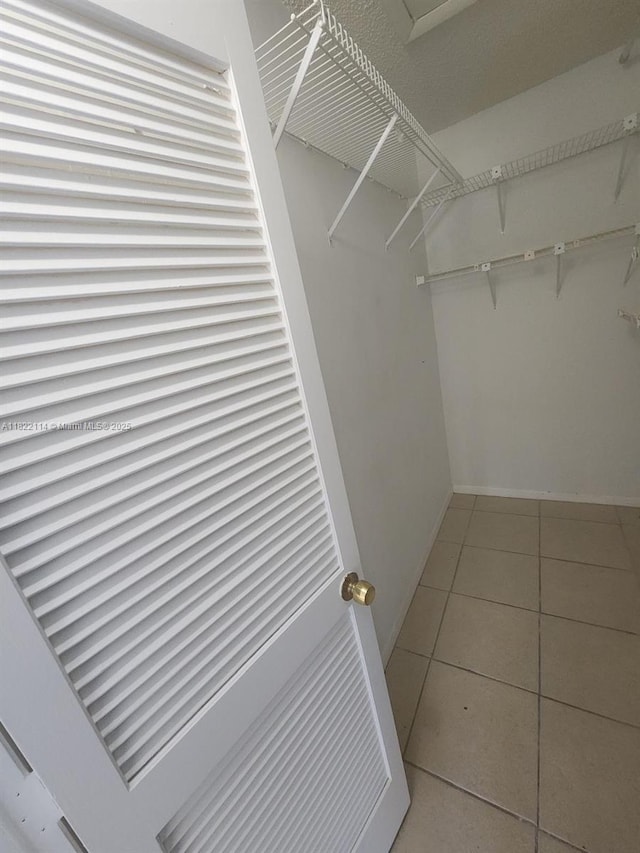 4150 NW 90th Ave Unit 203, Coral Springs, FL 33065 - spacious closet featuring tile patterned flooring