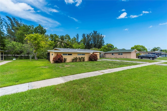 886 Camellia Dr, Royal Palm Beach, FL 33411 - ranch-style home featuring a front lawn and stucco siding