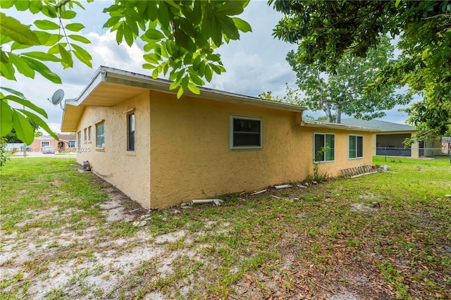 886 Camellia Dr, Royal Palm Beach, FL 33411 - view of side of property with stucco siding