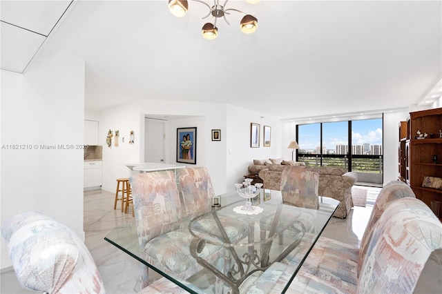 3530 Mystic Pointe Dr Unit 2108, Aventura, FL 33180 - dining space featuring light marble finish floors and a chandelier