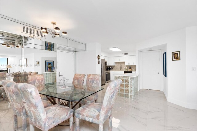 3530 Mystic Pointe Dr Unit 2108, Aventura, FL 33180 - dining room with light marble finish flooring and a chandelier