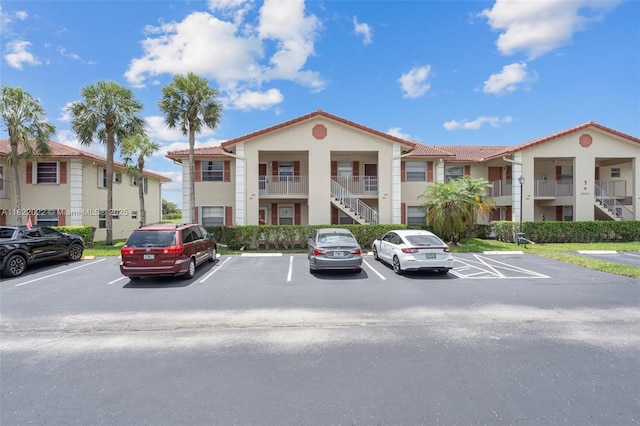 3001 Holiday Springs Blvd Unit 201, Margate, FL 33063 - view of property featuring uncovered parking and stairway