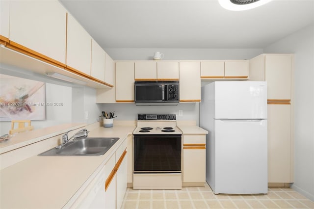 3001 Holiday Springs Blvd Unit 201, Margate, FL 33063 - kitchen featuring freestanding refrigerator, black microwave, electric range, and light countertops