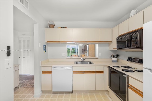 3001 Holiday Springs Blvd Unit 201, Margate, FL 33063 - kitchen featuring white appliances, cream cabinetry, and light countertops