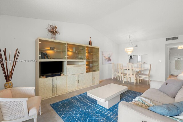 3001 Holiday Springs Blvd Unit 201, Margate, FL 33063 - living room featuring vaulted ceiling, a chandelier, and concrete flooring