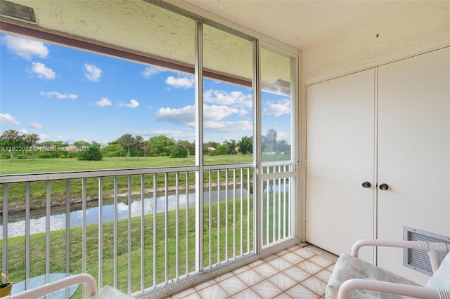 3001 Holiday Springs Blvd Unit 201, Margate, FL 33063 - sunroom / solarium with a water view and plenty of natural light