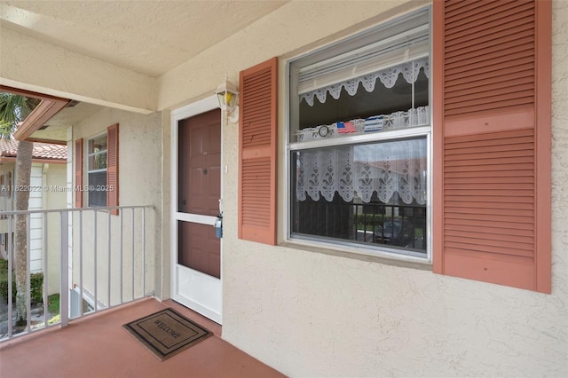 3001 Holiday Springs Blvd Unit 201, Margate, FL 33063 - entrance to property with stucco siding and a porch
