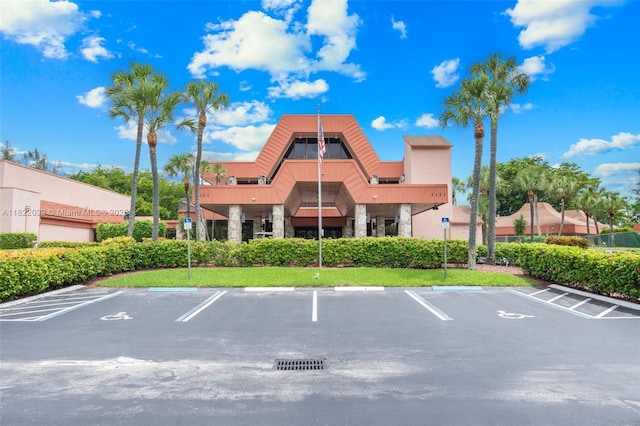 3001 Holiday Springs Blvd Unit 201, Margate, FL 33063 - view of building exterior featuring uncovered parking