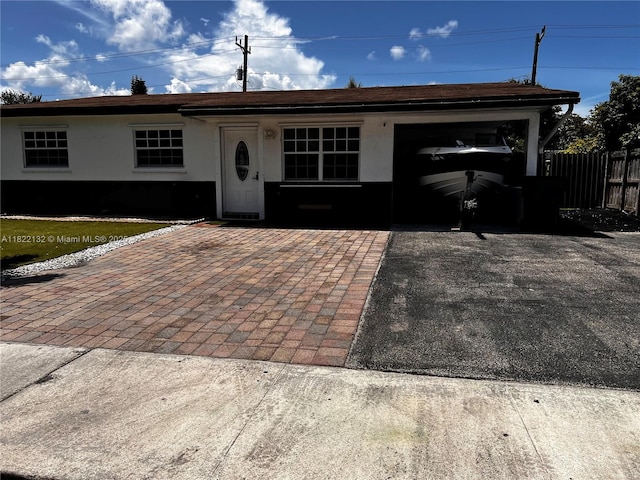 7151 Pershing St, Hollywood, FL 33024 - ranch-style house featuring stucco siding and driveway