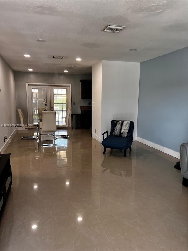 7151 Pershing St, Hollywood, FL 33024 - sitting room with french doors, a textured ceiling, and recessed lighting