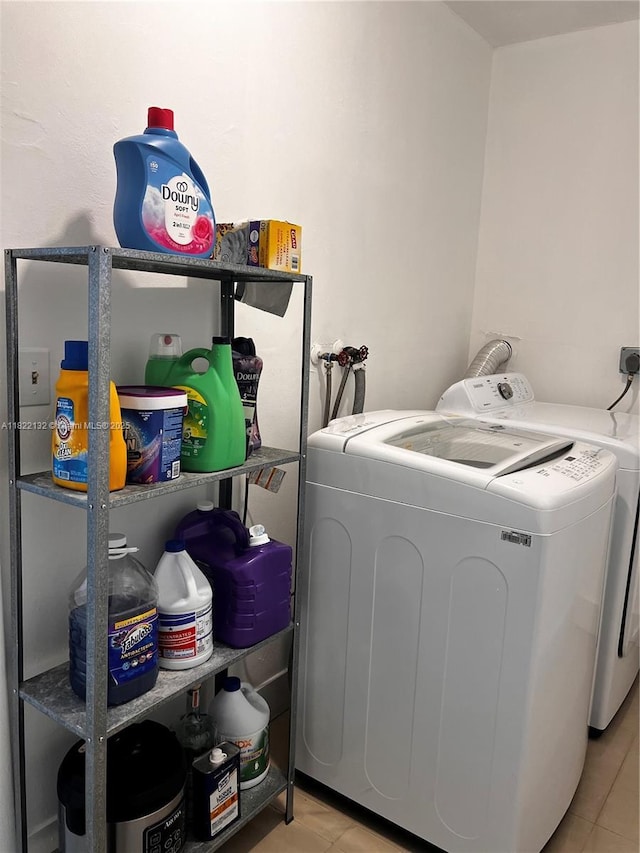 7151 Pershing St, Hollywood, FL 33024 - washroom featuring washing machine and clothes dryer and tile patterned flooring