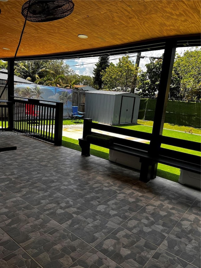 7151 Pershing St, Hollywood, FL 33024 - view of property's community with a storage unit, a patio area, and a fenced backyard
